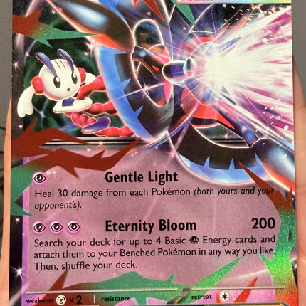 Carta individual Pokémon Mega Floette EX Real 035/086, rareza Double Rare, MEGA Evolution, 250 HP, set Chaos Rising (CRI). Ilustración full art de Mega Floette EX canalizando un poderoso rayo de energía rosa y blanca por aky CG Works - Thunder Cards México.