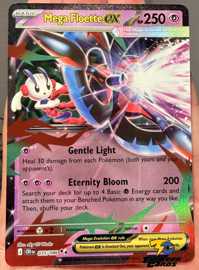 Carta individual Pokémon Mega Floette EX Real 035/086, rareza Double Rare, MEGA Evolution, 250 HP, set Chaos Rising (CRI). Ilustración full art de Mega Floette EX canalizando un poderoso rayo de energía rosa y blanca por aky CG Works - Thunder Cards México.